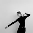 Monochrome image capturing a graceful female dancer in movement.