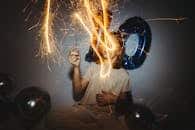 A vibrant 10th birthday party with sparklers and blue balloons creating a magical atmosphere.