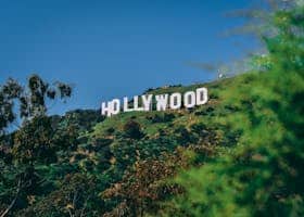 A scenic view of the famous Hollywood sign on a sunny day in Los Angeles.